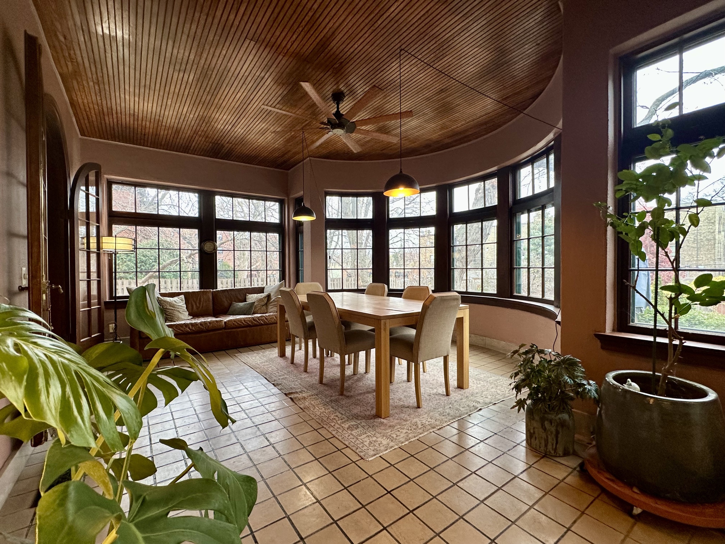 The sunroom at 638 Summit Avenue, set for afternoon coffee with morning light streaming through the east windows.